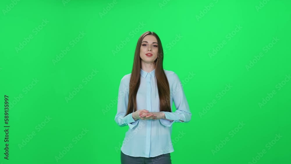 Woman speaker looks into the camera and speaks, green background, template for TV agencies, pretty journalist at work, breaking news. Woman speaker looks into the camera and speaks, green background, template for TV agencies, pretty journalist at work, breaking news.