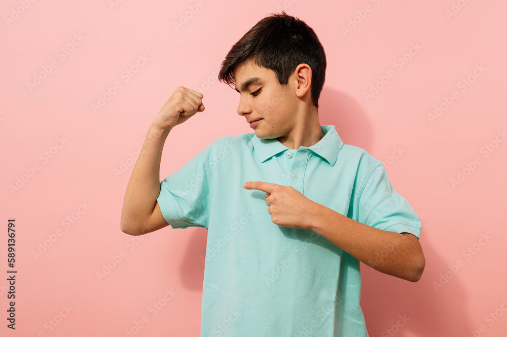 Young guy doing power handstand in studio. Young guy doing power handstand in studio.