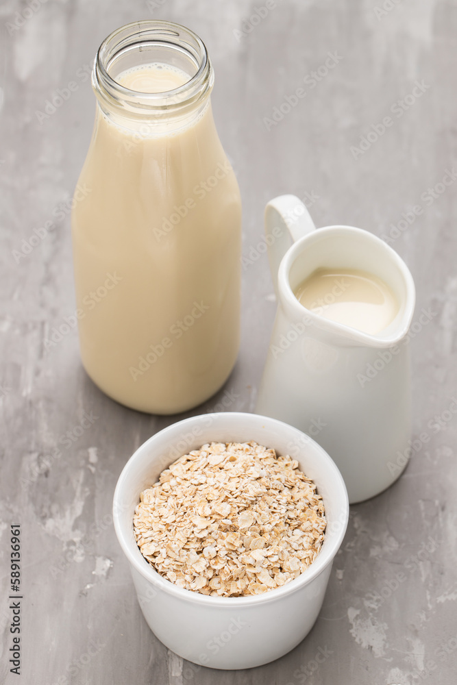 Oat milk. Healthy vegan non-dairy organic drink with flakes Oat milk. Healthy vegan non-dairy organic drink with flakes
