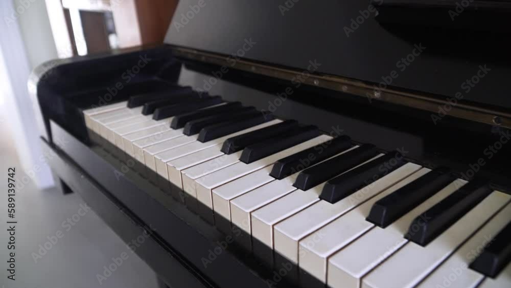 sliding the shot of piano keys at house sliding the shot of piano keys at house