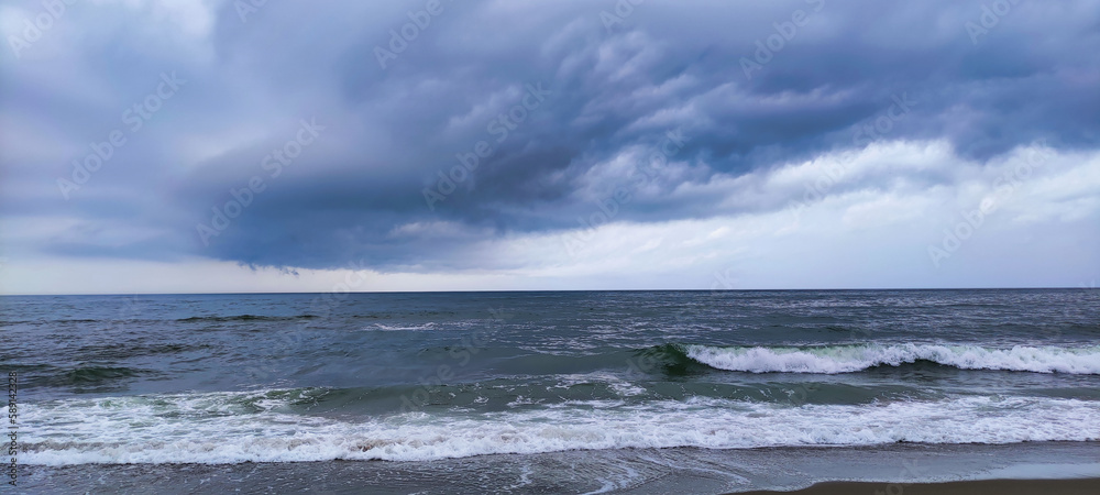 Waves in the Black Sea during a storm. Cloudy weather. Karolino-Bugaz. Ukraine. Europe Waves in the Black Sea during a storm. Cloudy weather. Karolino-Bugaz. Ukraine. Europe