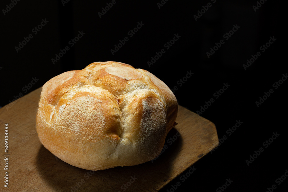 Freshly baked bread on rustic wooden table
