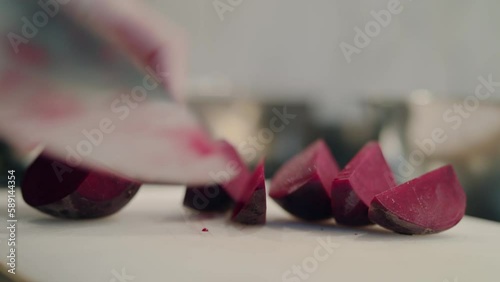 Wallpaper Mural A woman chef carefully and expertly cuts vibrant beetroot into sectors in her clean kitchen. Healthy vegetarian cooking concept. Torontodigital.ca