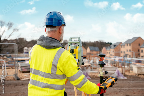 фотографія Surveyor builder site engineer with theodolite total station at construction sit