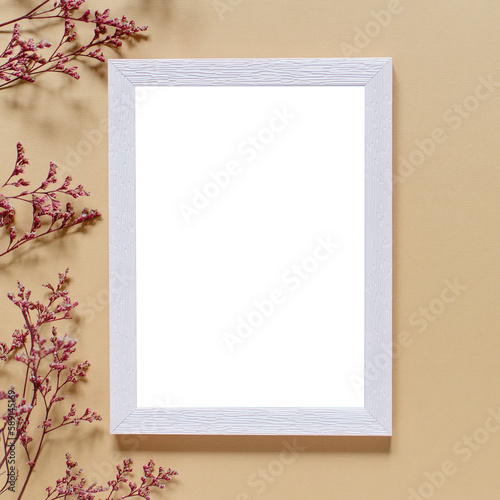 Blank greeting card, invitation and envelope mockup. Minimal floral frame made of dry flowers and branches. Flat lay, top view. Happy mother's day, birthday, wedding composition.