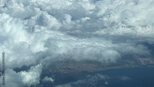 Threatening storm clouds over Palma de Mallorca Island, seen from a jet cockpit flying at 7000m high. Pilot’s point of view. photo