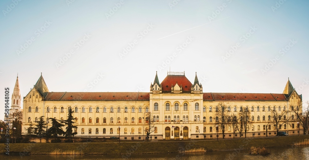 Beautiful shot of the Municipal Court on a river bank in Zrenjanin, Serbia on a sunny day
