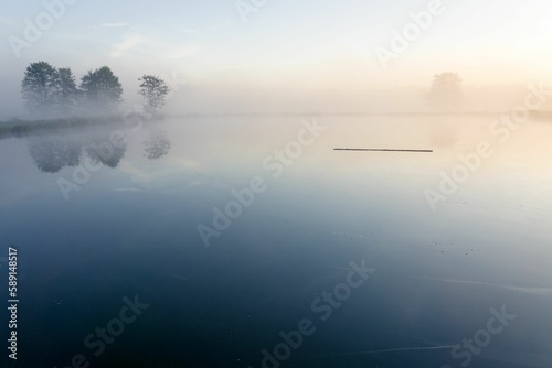 Beautiful view of a lake covered in fog.
