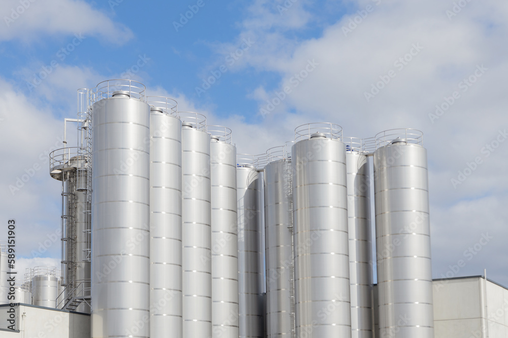 A close up of Industrial silos for food milk production A close up of Industrial silos for food milk production