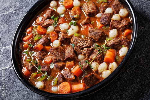 boneless beef short ribs stew in black bowl
