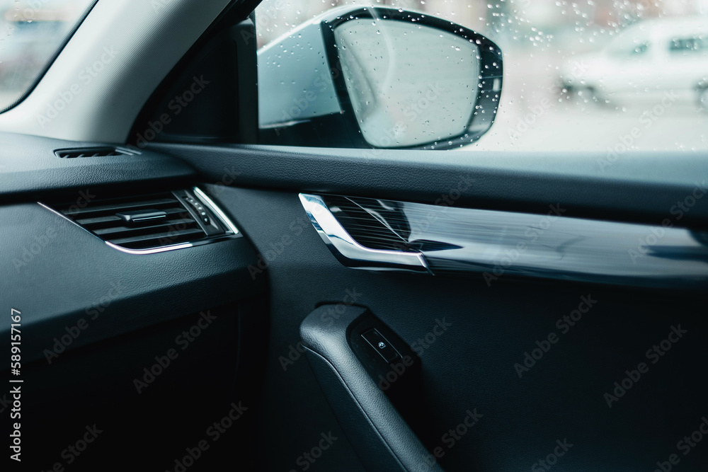 The modern interior of the car is black. Interior details.