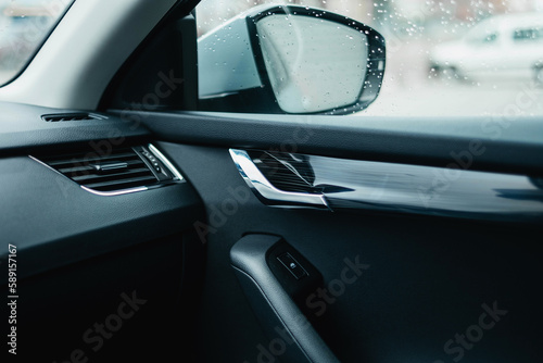 The modern interior of the car is black. Interior details. © ARTUR