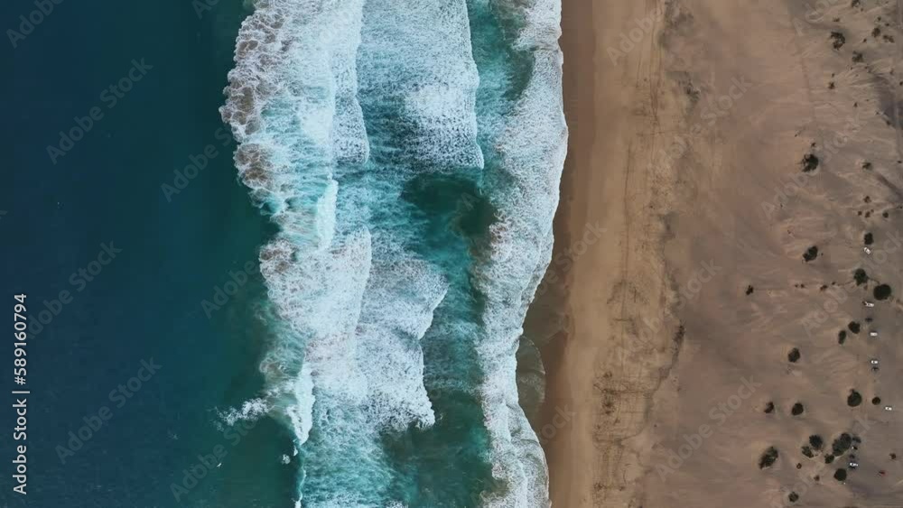 View from above, stunning aerial view of Cofete beach with beautiful ocean waves. Fuerteventura, Canary Islands. View from above, stunning aerial view of Cofete beach with beautiful ocean waves. Fuerteventura, Canary Islands.