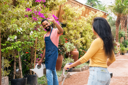 Entrepreneur greets customer in front of the trade.