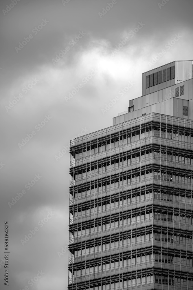 modern office building with clouds