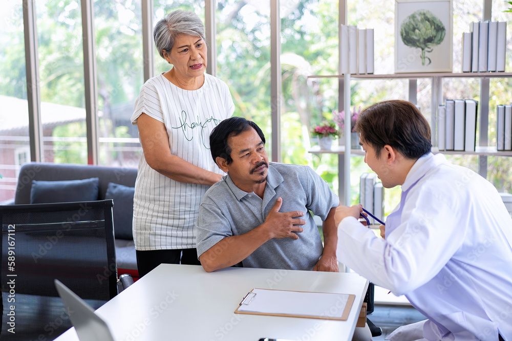 Senior couple talking with a doctor about their medical records and having consultations at clinic. Senior couple talking with a doctor about their medical records and having consultations at clinic.