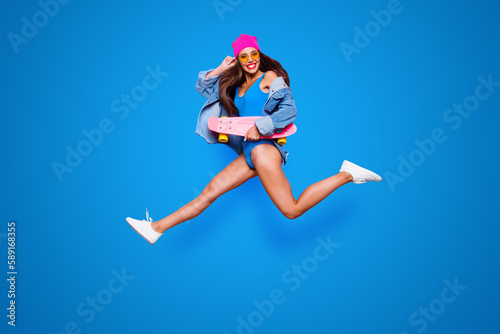 Lifestyle leisure dream dreamy person people concept. Side profile full length size studio photo portrait of funny funky cheerful careless beautiful cool girl jumping up isolated bright background