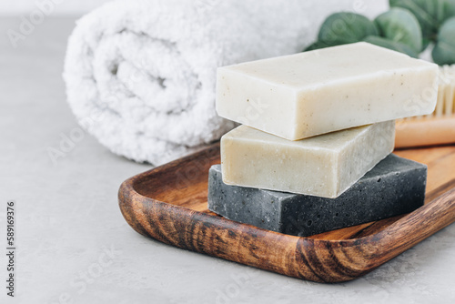 Soap. Organic soap bars. Stack of natural soap bars on gray stone background