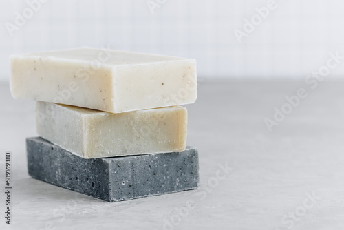 Soap. Organic soap bars. Stack of natural soap bars on gray stone background photo