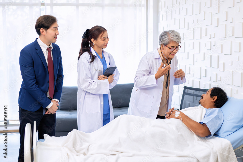 Hospital treatment room relative visit patient lay on bed doctor use stethoscope measurement Hospital treatment room relative visit patient lay on bed doctor use stethoscope measurement