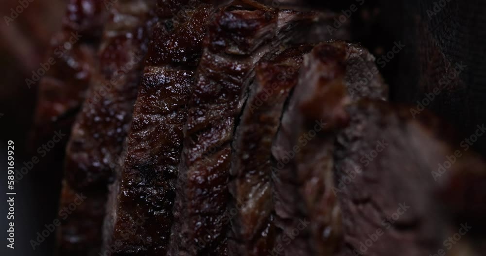 Roast beef on cutting board with salt and pepper. View from above. Macro shot meat roast beef.
