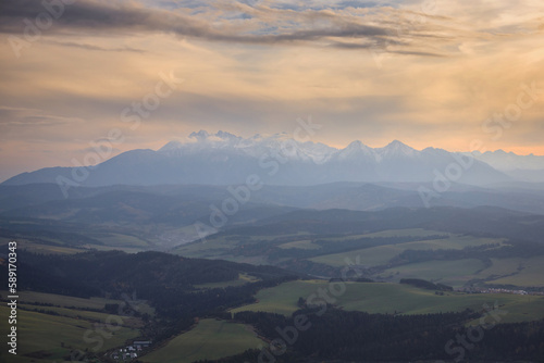 View of the Tatra maountains from the Three Cowns Peak in Pieniny at sunset Poland photo