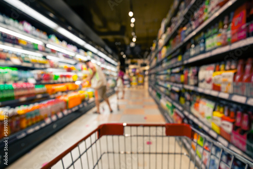 Defocused blur put on the at alcohol drink products in supermarket