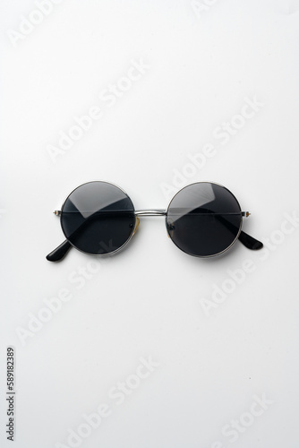 Sunglasses on a white background top view