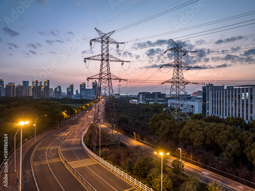 high-voltage power lines. high voltage electric transmission tower at sunset.
