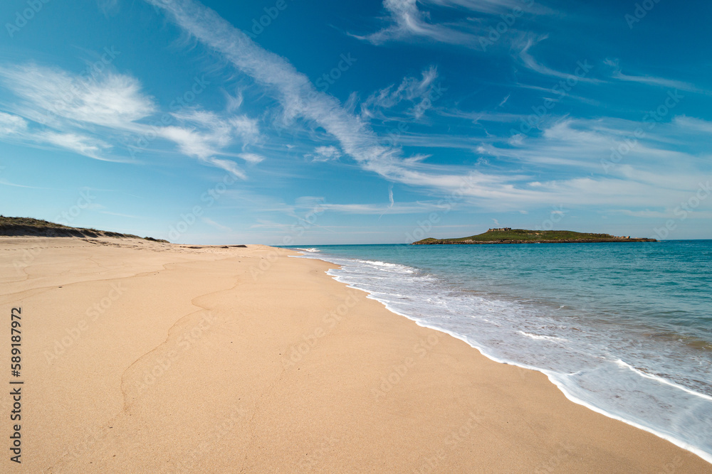 Walk along the Atlantic Ocean on the beach called Praia da Ilha do Pessegueiro near Porto Covo, western Portugal. Steps over Rota Vicentina Walk along the Atlantic Ocean on the beach called Praia da Ilha do Pessegueiro near Porto Covo, western Portugal. Steps over Rota Vicentina