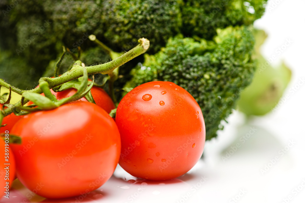 Branch with tomatoes on a white background. Branch with tomatoes on a white background.