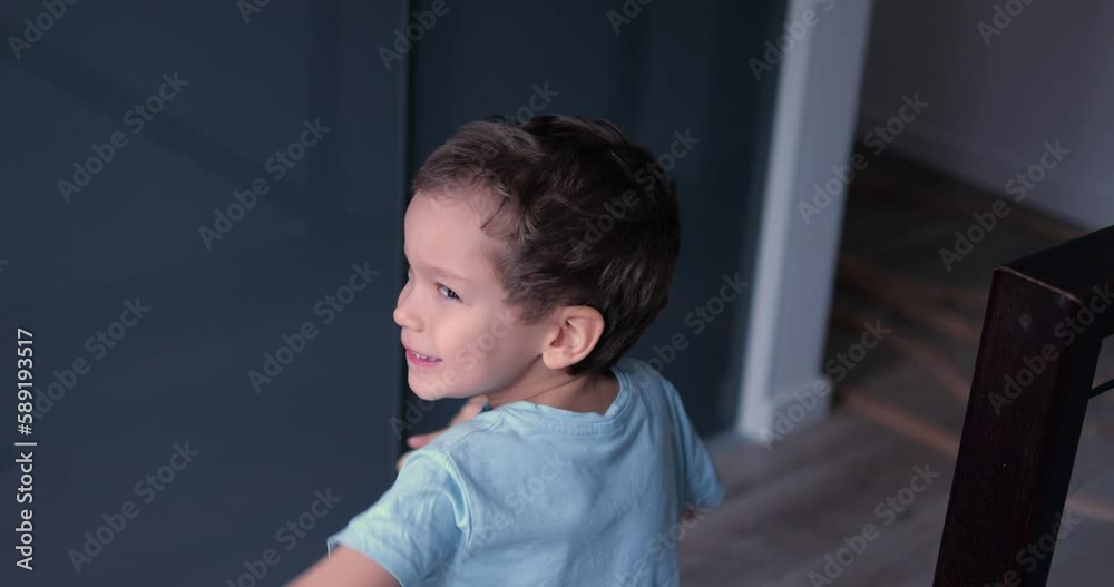Five year age boy happy dance and rotate arms hold ladyfinger cookie. Preschool male child has funny leisure joy time at home in family Five year age boy happy dance and rotate arms hold ladyfinger cookie. Preschool male child has funny leisure joy time at home in family