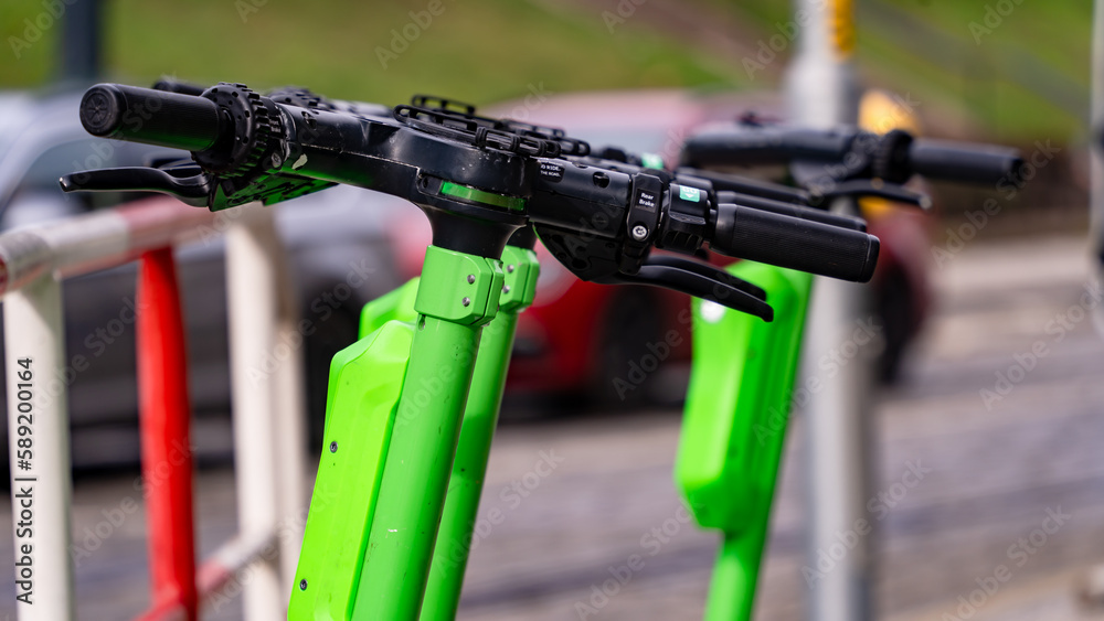 Electric rentable scooters in a city Electric rentable scooters in a city