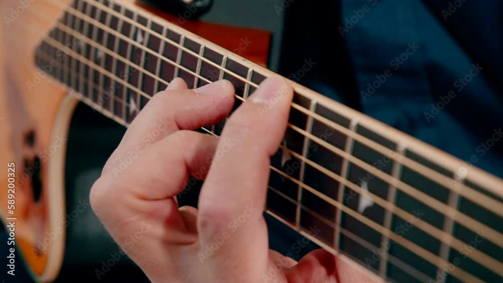 Handheld Shot Of A Man Playing Acoustic Guitar Handheld Shot Of A Man Playing Acoustic Guitar