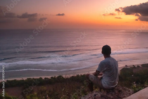 Lone Male Absorbing the Beauty of the Sunset at nyangnyang beach, Bali © dek