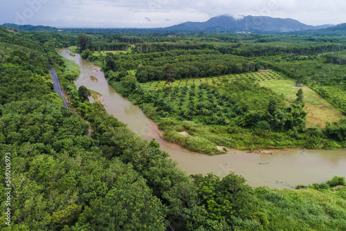 Aerial view asphalt road in tropical rain forest