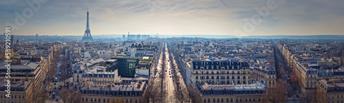 Paris cityscape panoramic view to the Eiffel Tower, France. Beautiful parisian architecture with historic buildings, landmarks and busy city streets © psychoshadow