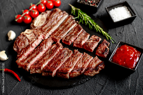 grilled T-bone steak on stone background