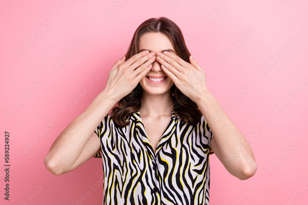 Photo of satisfied playful lady arms covering eyes beaming smile play hide-and-seek isolated on pink color background
