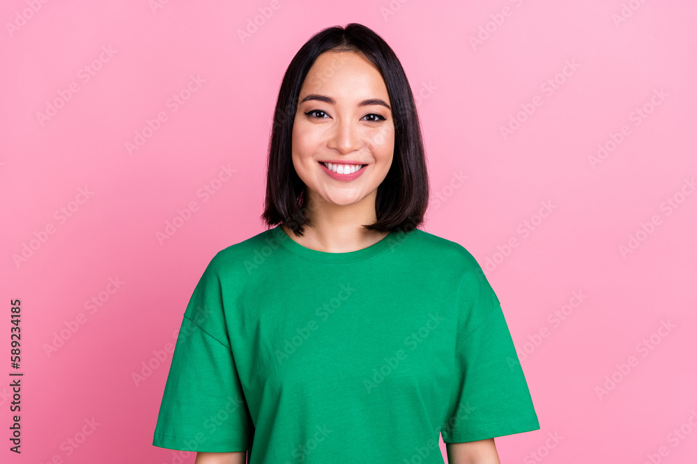 Photo of adorable satisfied pleasant pretty girl with bob hairdo dressed green t-shirt toothy smiling isolated on pink color background Photo of adorable satisfied pleasant pretty girl with bob hairdo dressed green t-shirt toothy smiling isolated on pink color background