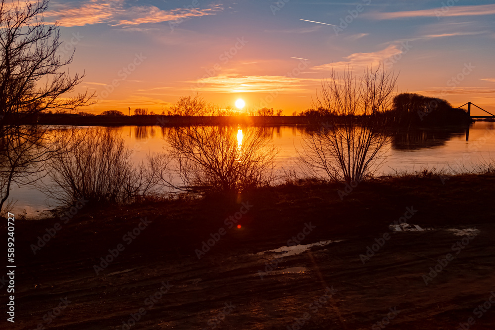 Fototapeta premium Sunset with reflections near Metten, Danube, Bavaria, Germany