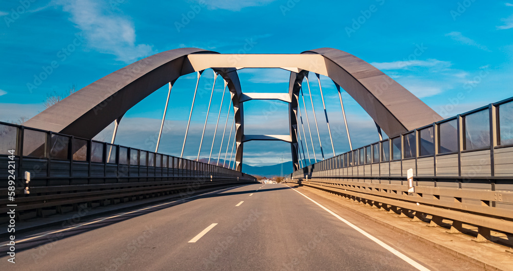 Obraz premium Winter view on a sunny day with a bridge at Plattling, Isar, Bavaria, Germany