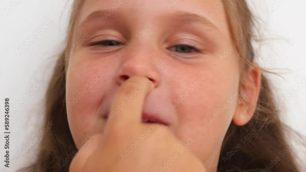 Animated shot of funny, playful, smiling close up cute blond girl with blue eyes picking her nose with two hands. Index fingers in nose on white studio background. Bad child habits, nose checking Animated shot of funny, playful, smiling close up cute blond girl with blue eyes picking her nose with two hands. Index fingers in nose on white studio background. Bad child habits, nose checking