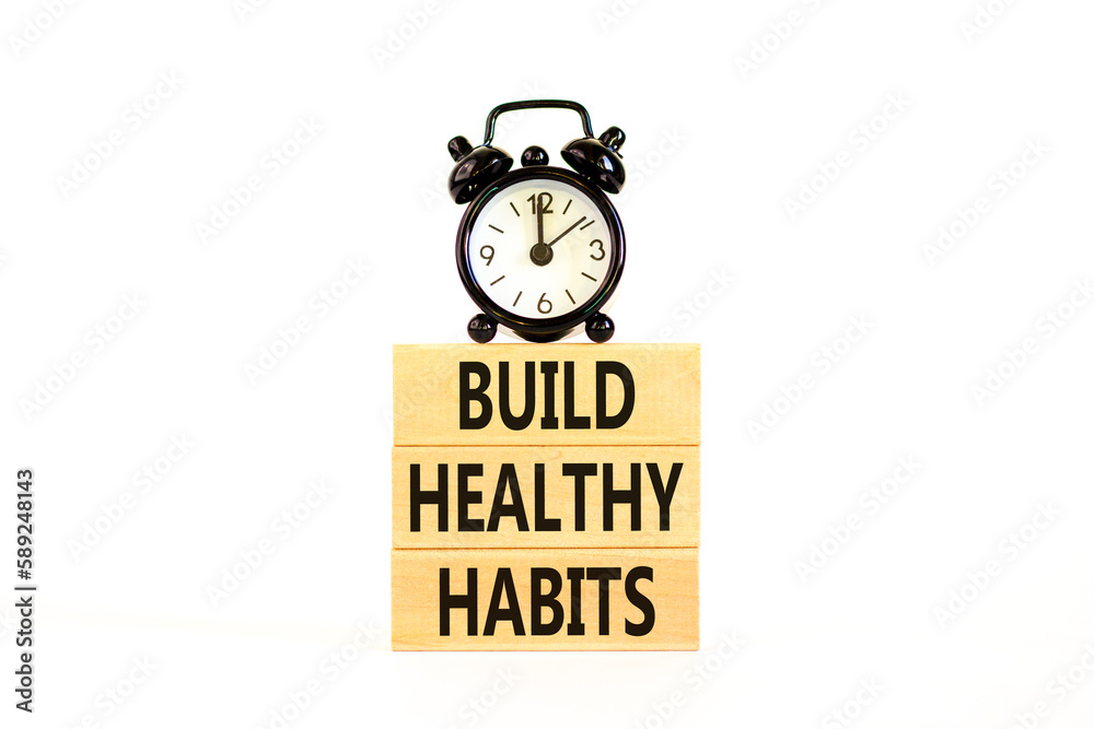 Motivation and Build healthy habits symbol. Concept words Build healthy habits on wooden block on a beautiful white table white background. Business build healthy habits concept. Copy space. Motivation and Build healthy habits symbol. Concept words Build healthy habits on wooden block on a beautiful white table white background. Business build healthy habits concept. Copy space.