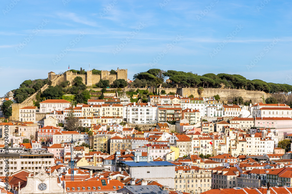 View from Miradouro de Sao Pedro de Alcantara of the the Baixa district with Castelo Sao Jorge (St Georges Castle) in the distance, Lisbon, Portugal.