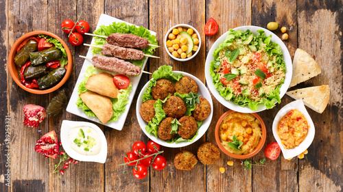 Lebanese, arabic food assortment- falafel, tabbouleh salad, beef kekab skewer and bread
