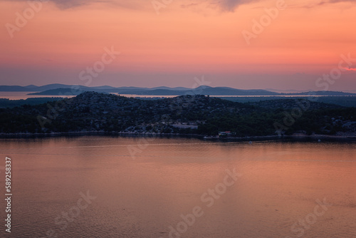 Scenic view of Sibenik bay and neighboring islands at twilight from St Michael’s fortress, Sibenik, Dalmatia, Croatia. Outdoor travel background