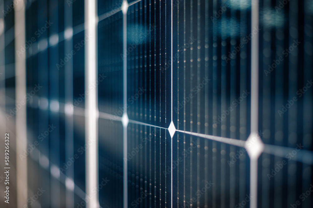 Multiple solar panels on the roof of a manufacturing building