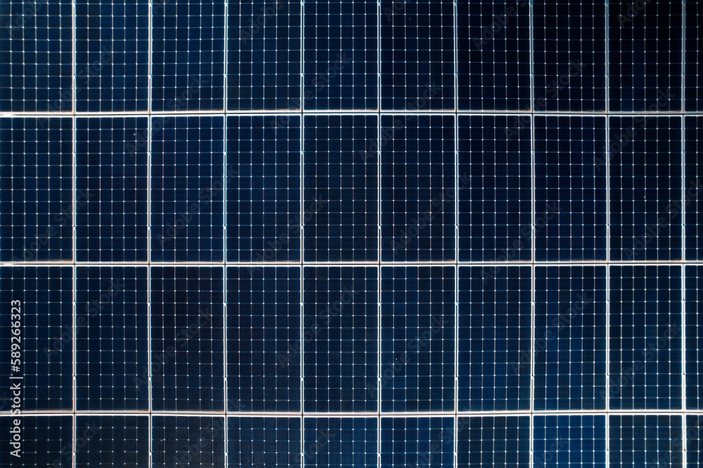 Multiple solar panels on the roof of a manufacturing building Multiple solar panels on the roof of a manufacturing building
