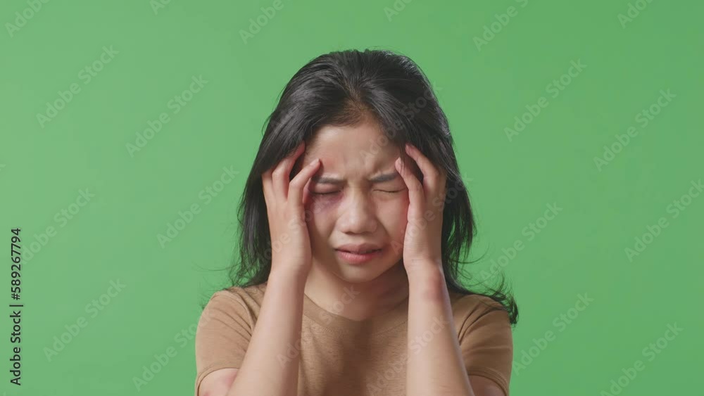 Close Up Of Young Asian Woman Victim Of Violence With Bruise On Face Having Nervous Breakdown And Screaming In The Green Screen Background Studio
Close Up Of Young Asian Woman Victim Of Violence With Bruise On Face Having Nervous Breakdown And Screaming In The Green Screen Background Studio